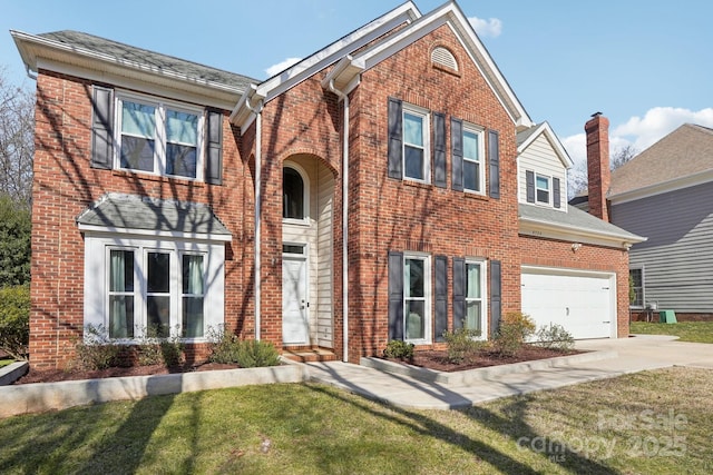 view of front of house featuring a garage and a front yard