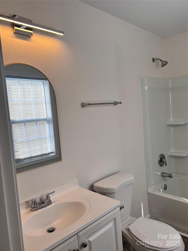 full bathroom featuring toilet, shower / washtub combination, and vanity