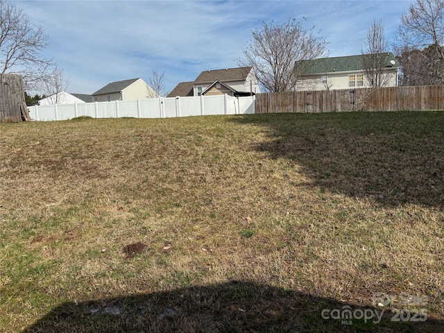 view of yard with fence