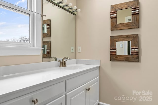 bathroom featuring vanity and a wealth of natural light