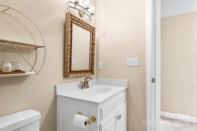 bathroom featuring vanity and toilet