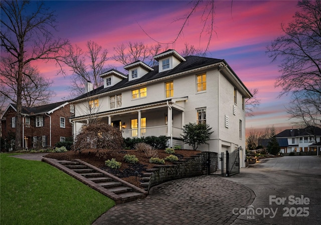 view of front of house with a garage and a porch