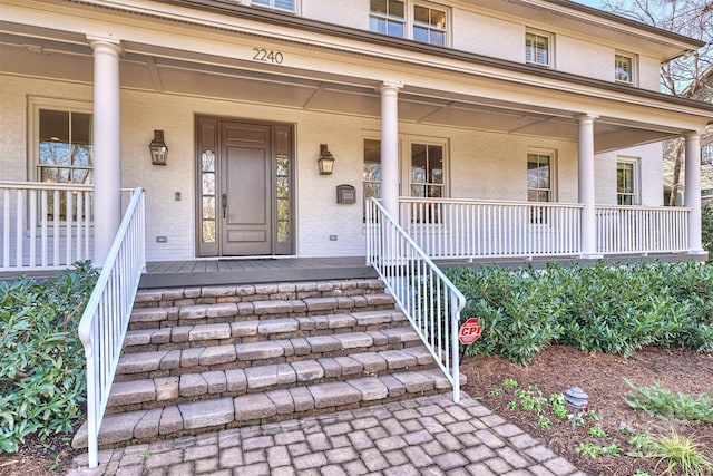 doorway to property with a porch