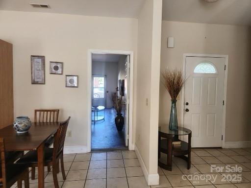 979 W Chapel Rd, Asheville, NC 28803 - entryway with light tile patterned flooring and baseboards
