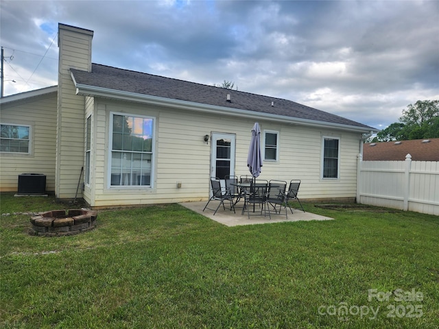 979 W Chapel Rd, Asheville, NC 28803 - rear view of house with an outdoor fire pit, a patio area, a chimney, and central AC unit