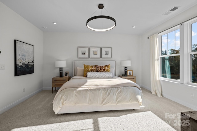 bedroom featuring light colored carpet