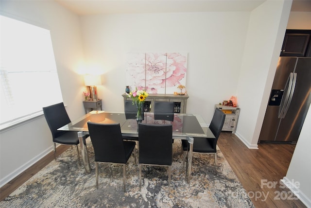 dining area featuring dark hardwood / wood-style flooring