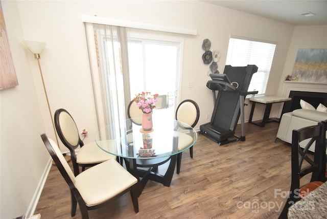 dining area with hardwood / wood-style flooring