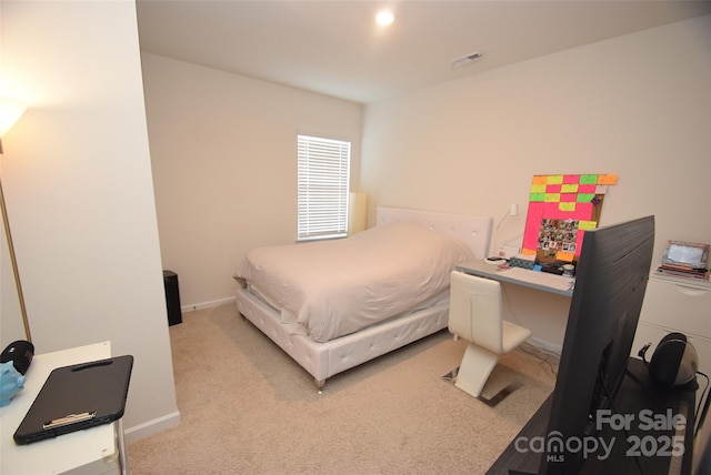 bedroom with light carpet