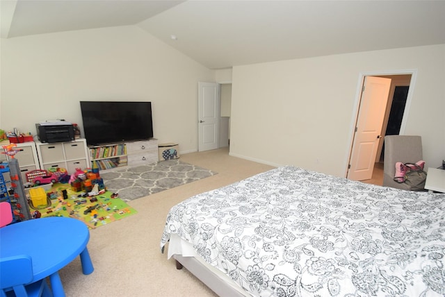 carpeted bedroom featuring vaulted ceiling