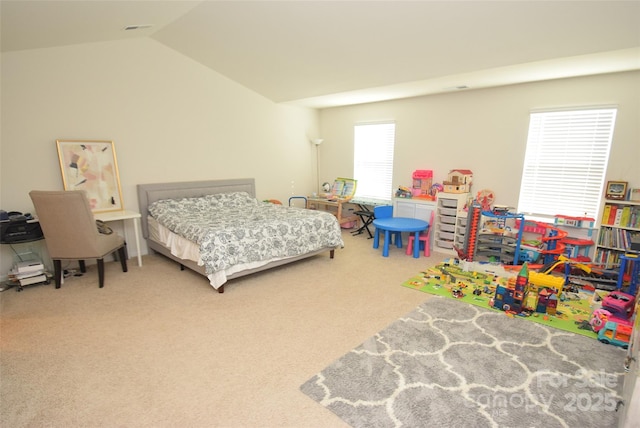 carpeted bedroom featuring lofted ceiling