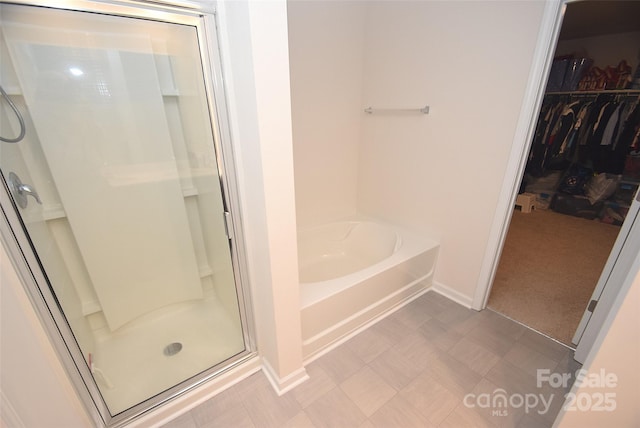 bathroom with separate shower and tub