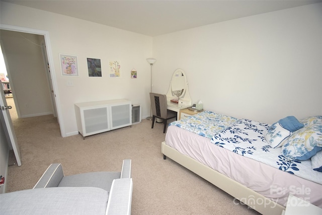 bedroom with light colored carpet