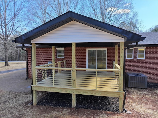 rear view of property featuring cooling unit