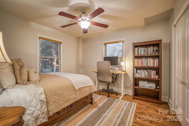 bedroom featuring hardwood / wood-style flooring and ceiling fan