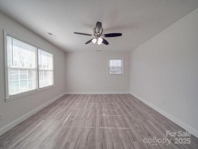 spare room featuring ceiling fan and light wood-type flooring