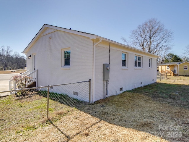 view of home's exterior featuring a yard