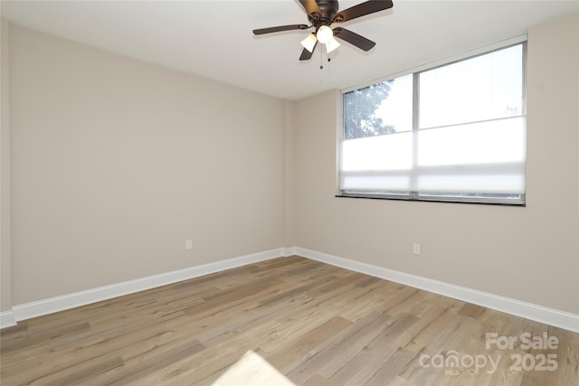 empty room featuring ceiling fan and light hardwood / wood-style floors