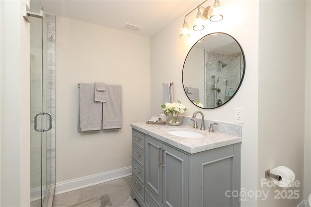 bathroom featuring vanity and walk in shower