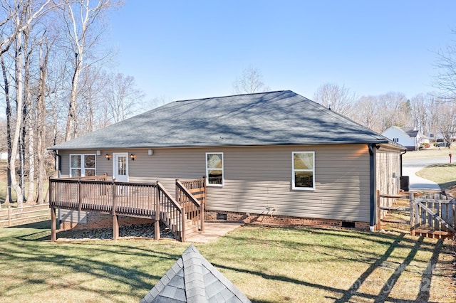 back of property featuring a shingled roof, a lawn, crawl space, fence, and a deck