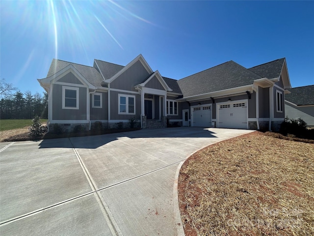 view of front facade featuring crawl space, an attached garage, a shingled roof, and driveway