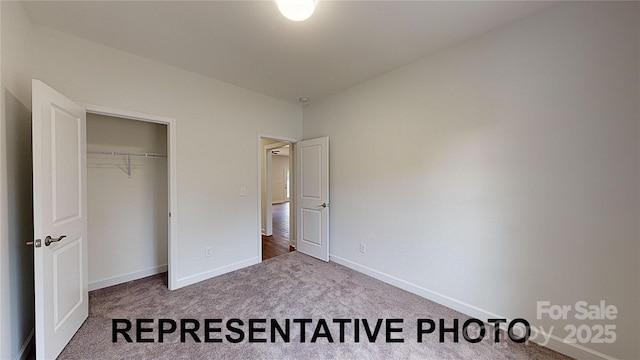 unfurnished bedroom with carpet floors and a closet