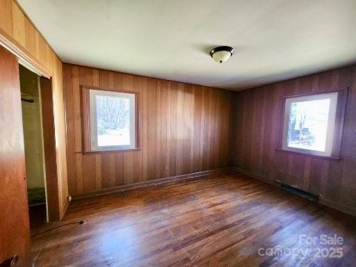 spare room with wood finished floors