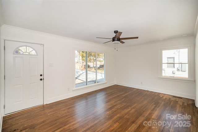 entrance foyer featuring ornamental molding, dark wood-type flooring, and ceiling fan