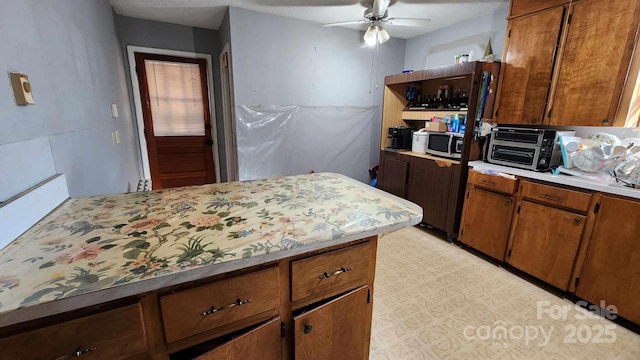 kitchen featuring ceiling fan