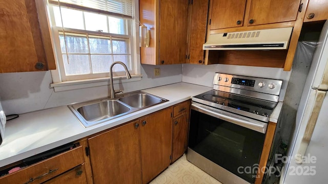 kitchen with sink, electric range, ventilation hood, and white refrigerator