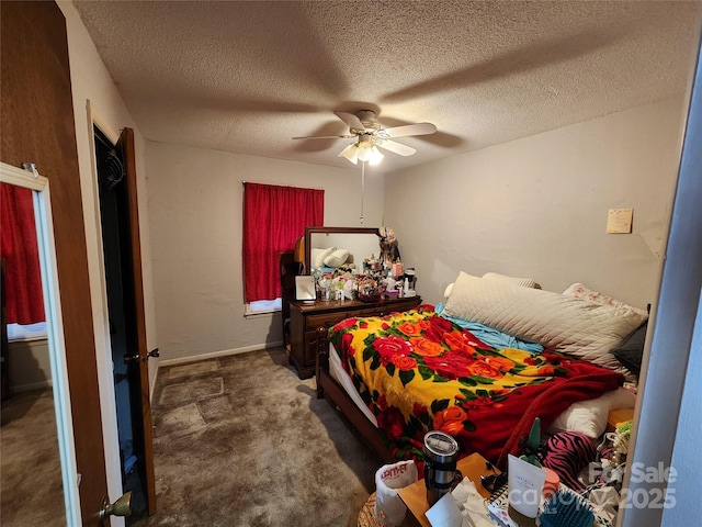 carpeted bedroom with a textured ceiling and ceiling fan