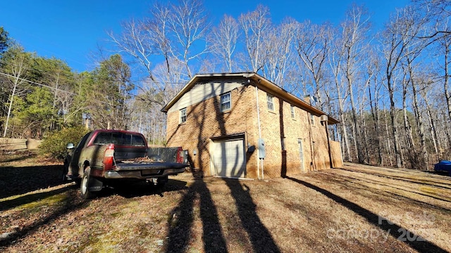 view of side of property featuring a garage