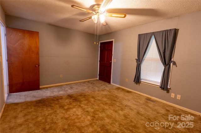3581 Thompson St, Newton, NC 28658 - carpeted spare room featuring a textured ceiling, a ceiling fan, and baseboards