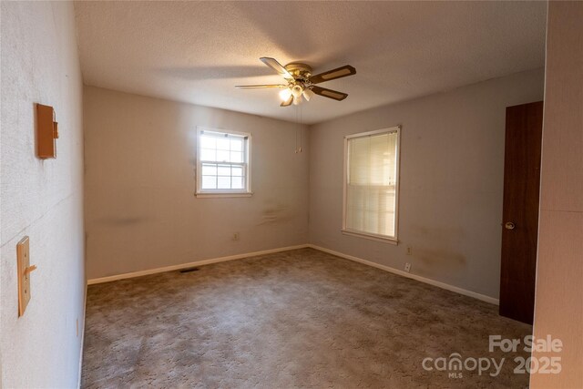 3581 Thompson St, Newton, NC 28658 - unfurnished room featuring ceiling fan, carpet floors, baseboards, and a textured ceiling