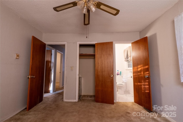 3581 Thompson St, Newton, NC 28658 - unfurnished bedroom featuring a textured ceiling, carpet floors, a closet, and ceiling fan