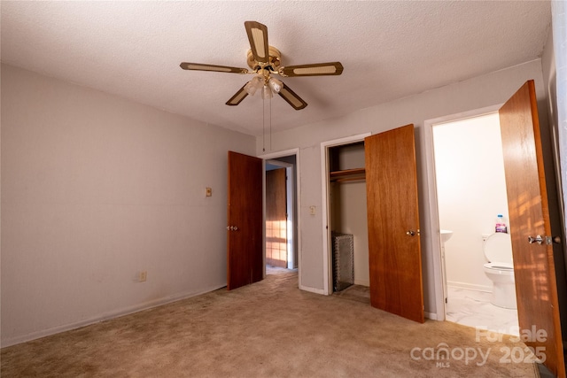 3581 Thompson St, Newton, NC 28658 - unfurnished bedroom with a closet, carpet floors, ensuite bath, a textured ceiling, and a ceiling fan