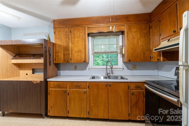 3581 Thompson St, Newton, NC 28658 - kitchen featuring stainless steel range with electric stovetop, under cabinet range hood, a sink, brown cabinetry, and a textured ceiling