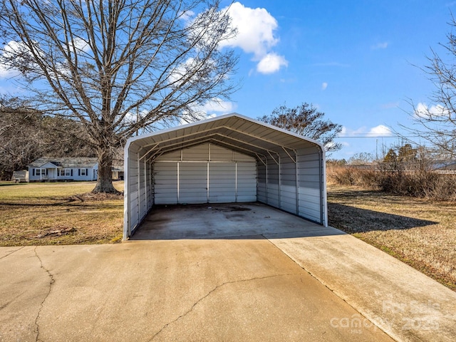 garage with a yard and a carport