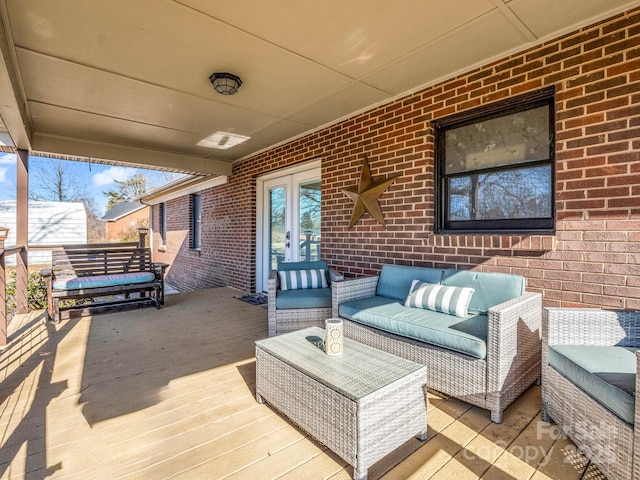 wooden deck featuring an outdoor living space