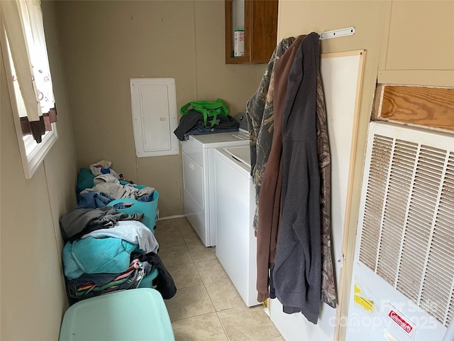 laundry room with light tile patterned flooring, independent washer and dryer, and electric panel