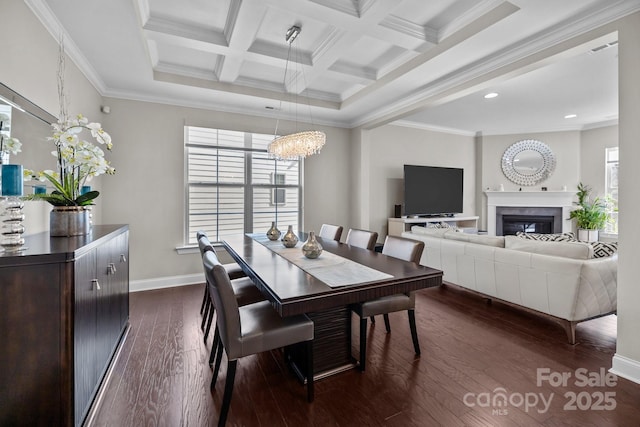 dining area featuring coffered ceiling, a healthy amount of sunlight, crown molding, and dark hardwood / wood-style floors