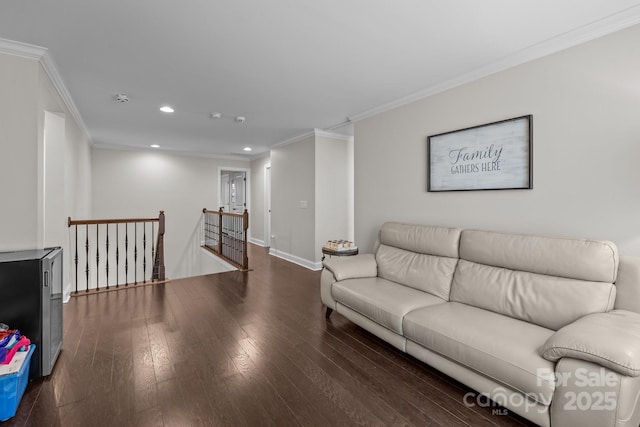 living room with dark wood-type flooring and ornamental molding