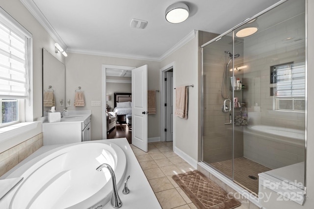 bathroom featuring vanity, tile patterned floors, ornamental molding, and separate shower and tub