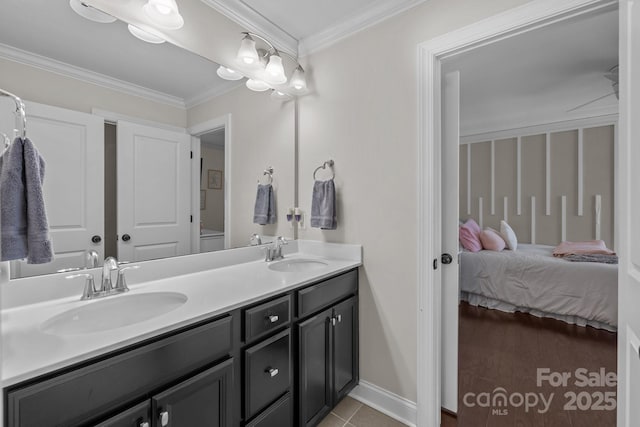 bathroom featuring ornamental molding, vanity, and tile patterned floors