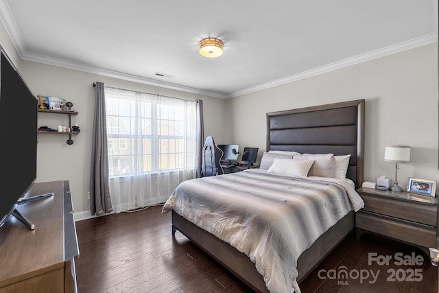 bedroom featuring crown molding and dark hardwood / wood-style floors