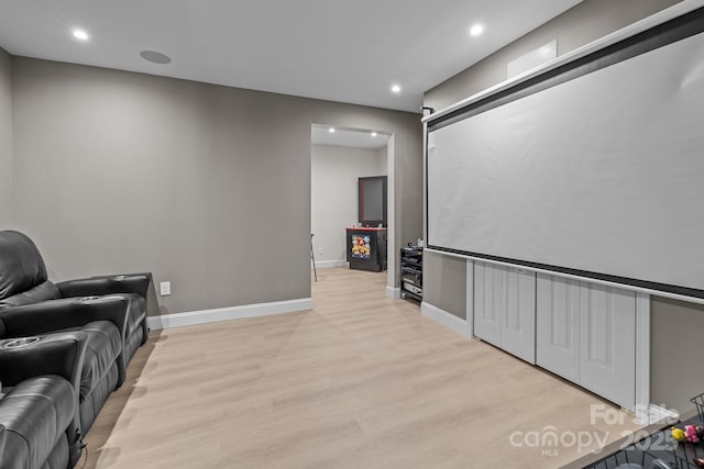 home theater featuring light wood-type flooring