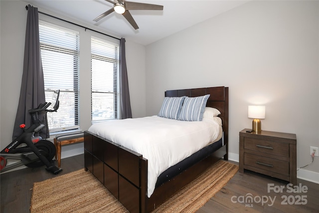 bedroom featuring ceiling fan and dark hardwood / wood-style flooring