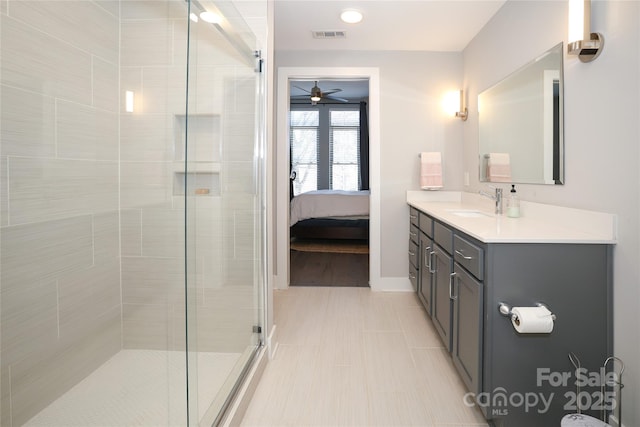 bathroom featuring vanity, ceiling fan, and walk in shower