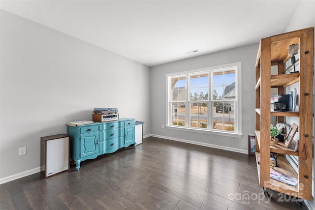 office area featuring dark wood-style floors, baseboards, and visible vents