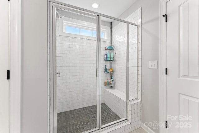 bathroom with a shower stall